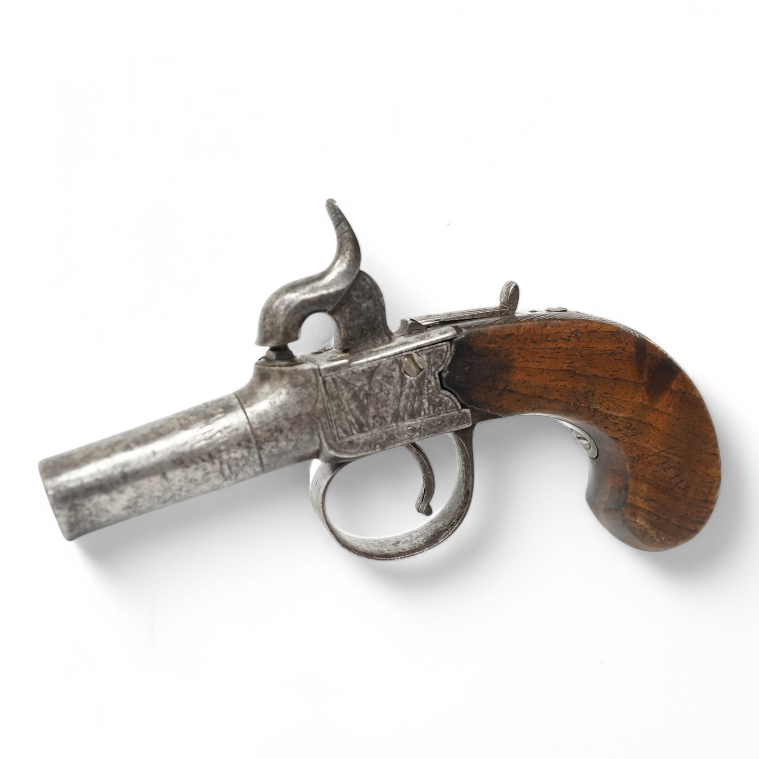 A boxlock percussion pocket pistol, Birmingham proved, frame engraved with flag trophies and signed Cook, London within ovals, sliding top thumb safety, partly chequered walnut grip with vacant silver escutcheon. Conditi